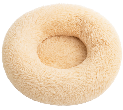Beige fluffy donut-shaped pillow on a white background