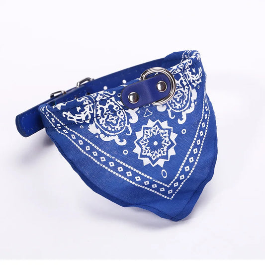 Blue bandana with white patterns and metal ring on a white background