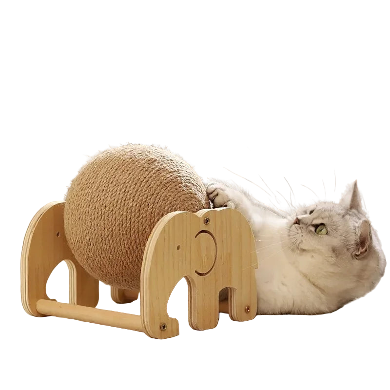 Cat playing with a wooden toy shaped like an elephant and a ball on a light-colored floor.