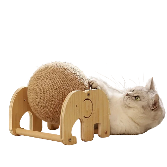 Cat playing with a wooden toy shaped like an elephant and a ball on a light-colored floor.