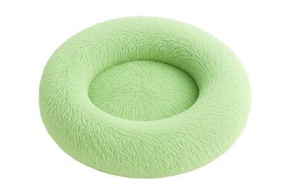 Light green donut-shaped pet bed on a white background