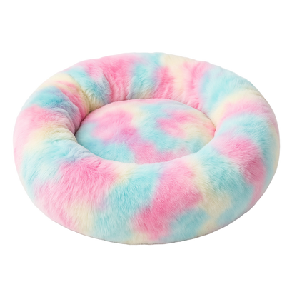 Pastel tie-dye donut pet bed on a white background