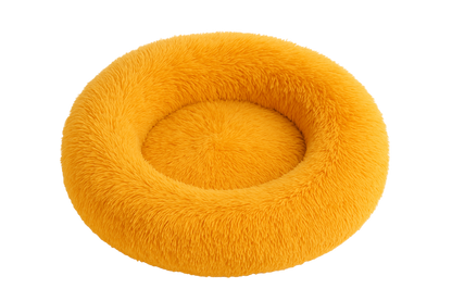 Yellow fluffy donut pet bed on a white background