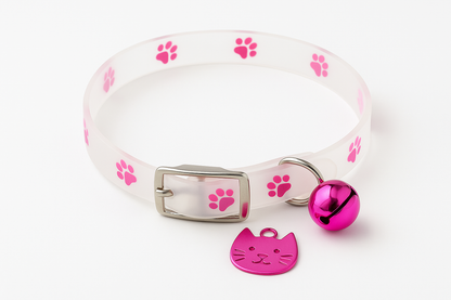 Cat collar with pink paw prints, a bell, and a cat-shaped tag on a white background