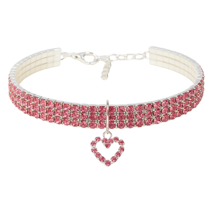 Pink crystal choker necklace with a heart pendant on a white background