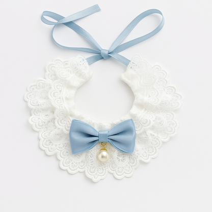 White lace collar with a blue bow and pearl on a white background