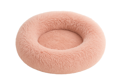 Pink fluffy donut pet bed on a white background