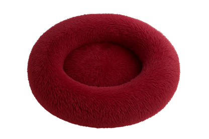 Red fluffy pet bed on a white background